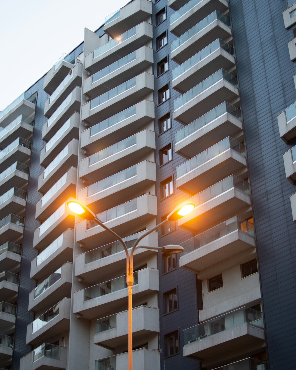 a street light in front of a tall building