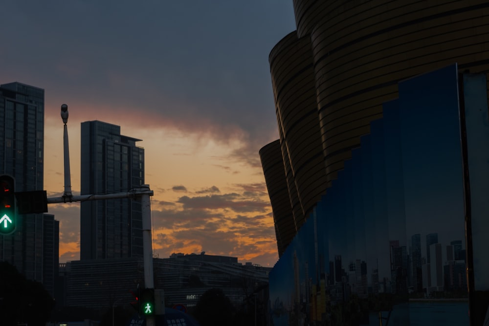 a traffic light with a building in the background