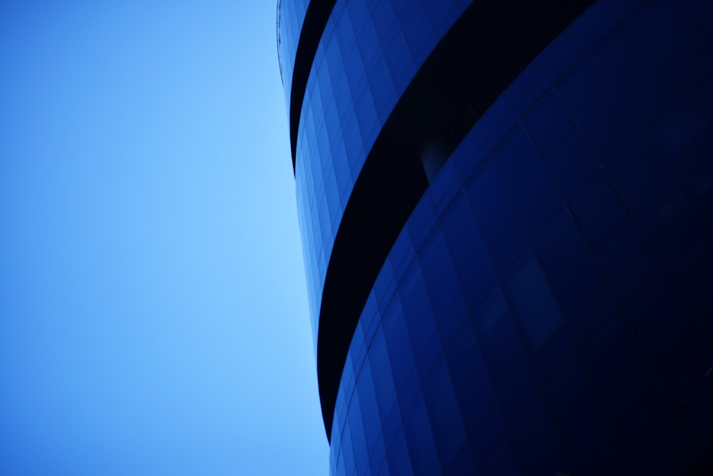 a tall building with a blue sky in the background