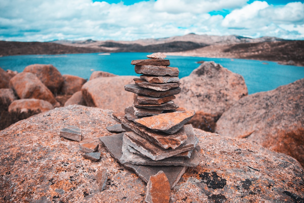 a stack of rocks sitting on top of a large rock