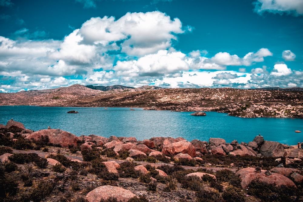 a large body of water surrounded by rocks