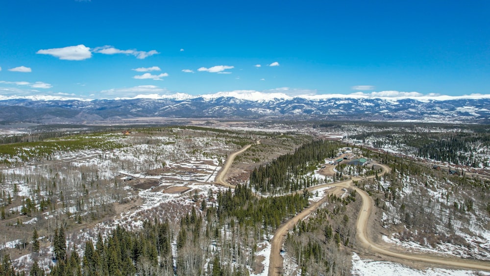 an aerial view of a road in the mountains