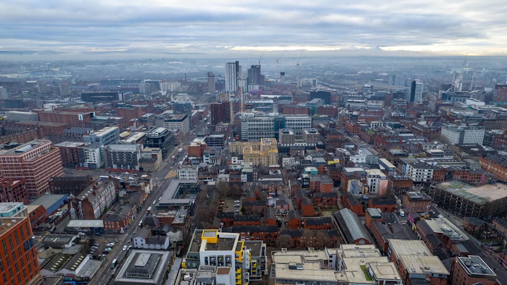 an aerial view of a city with tall buildings