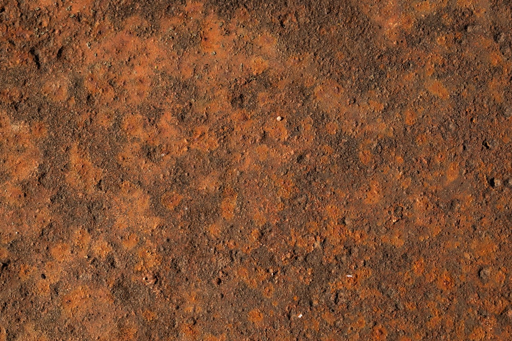 a close up of a rusted metal surface