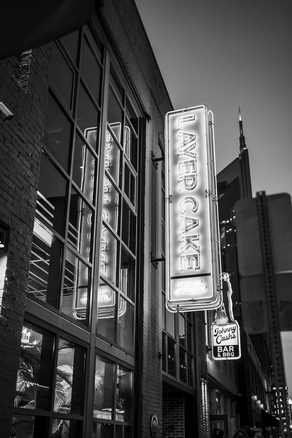 a black and white photo of a restaurant sign