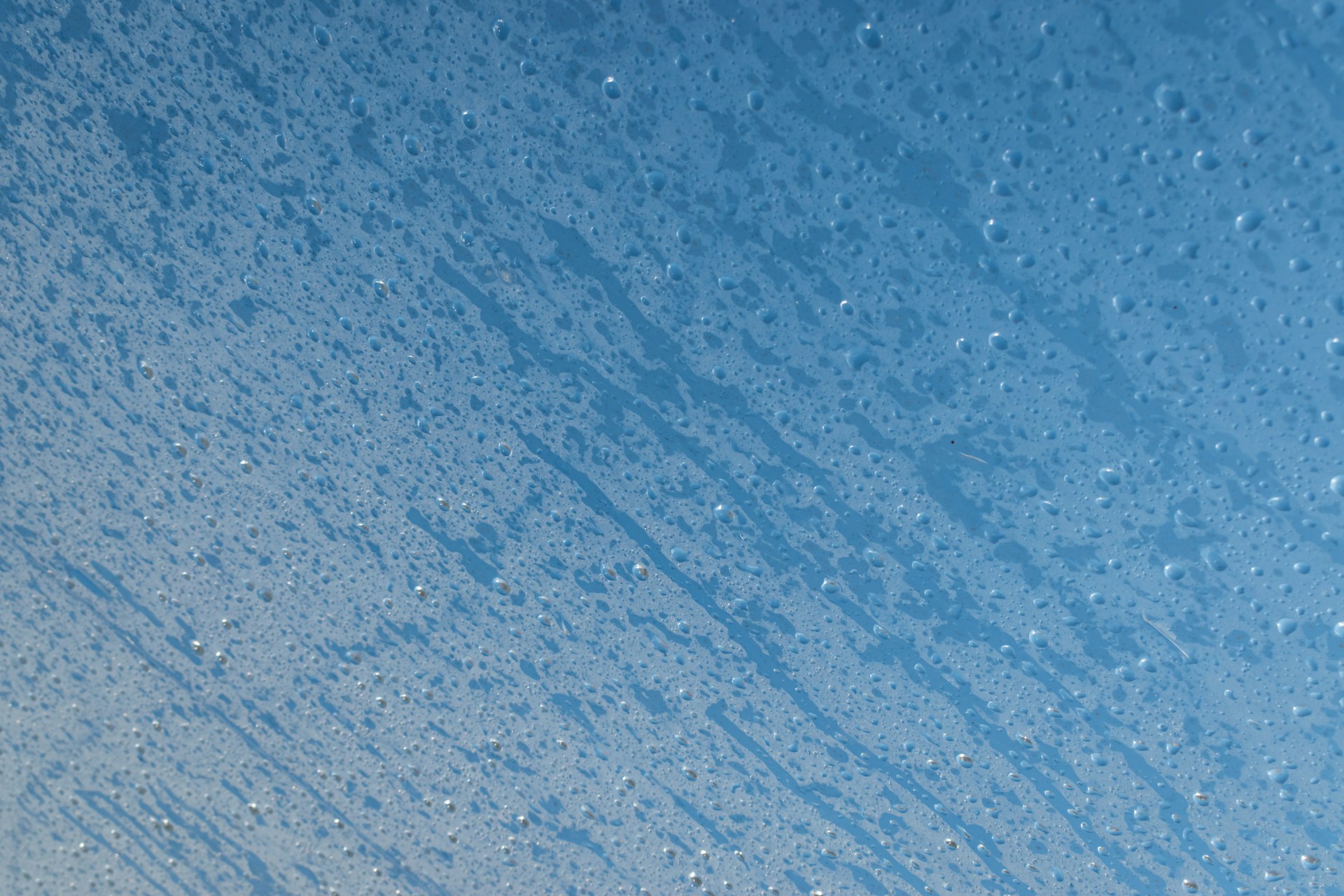 a blue sky with rain drops on it