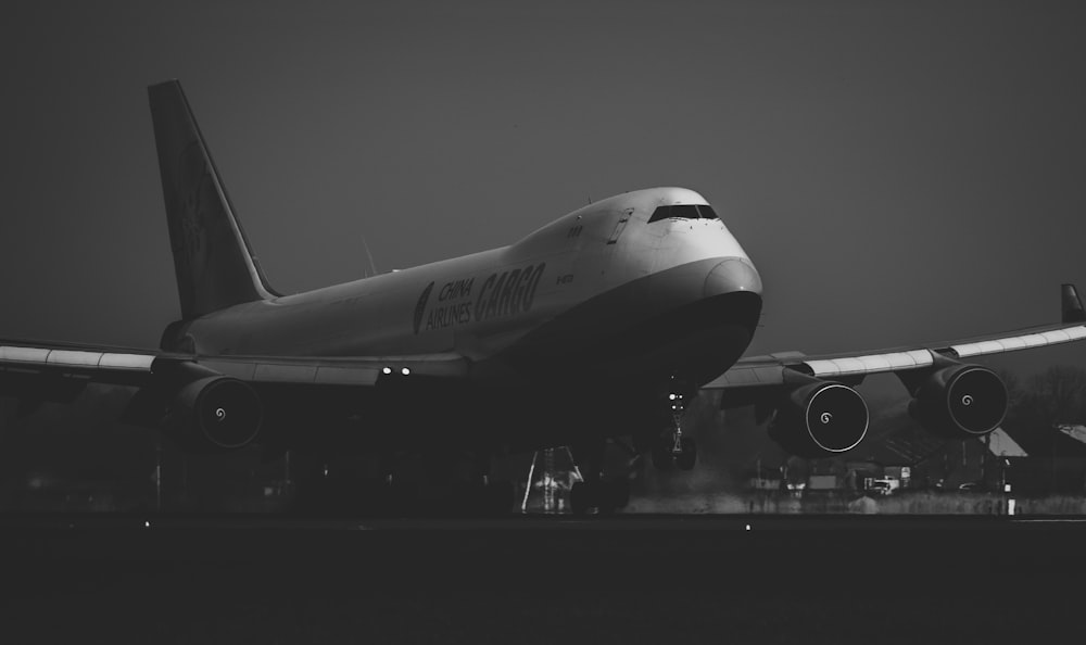 a large jetliner sitting on top of an airport tarmac