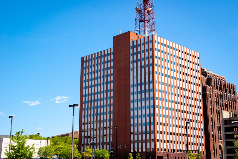 a tall building with a radio tower on top of it