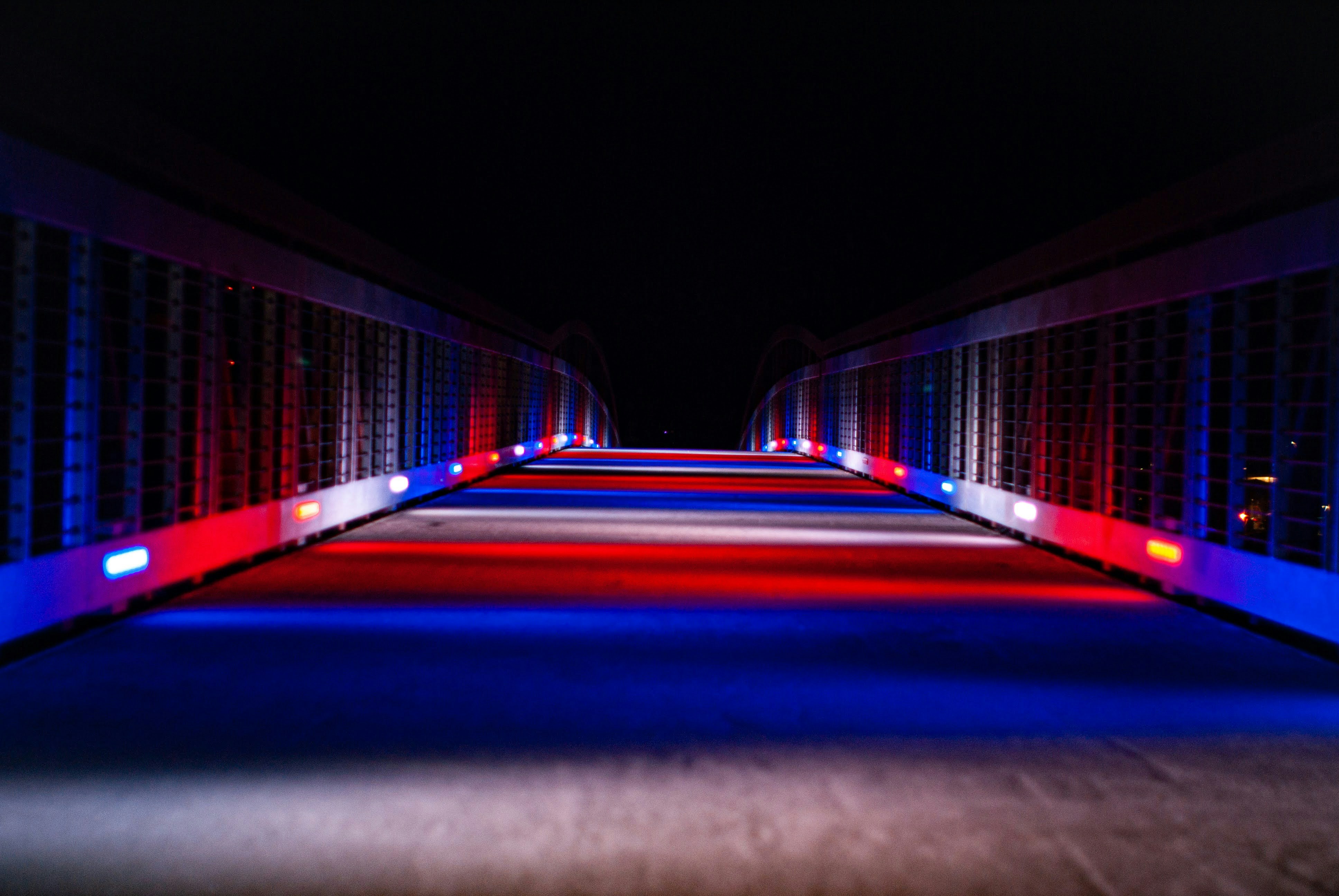 a long hallway with red, white and blue lights