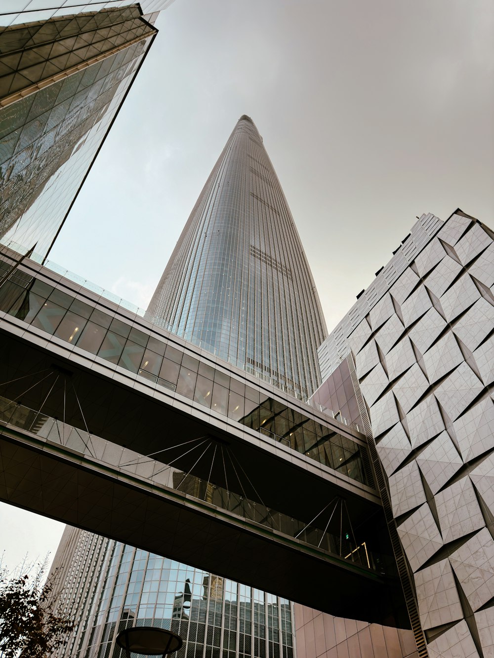 a very tall building towering over a city