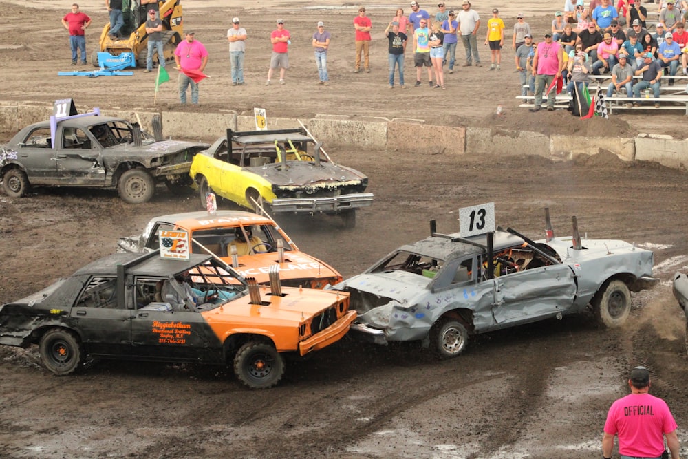 a couple of cars that are in the dirt