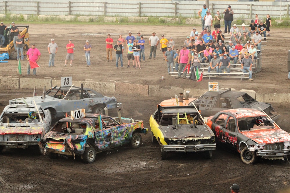 a group of cars that are sitting in the dirt