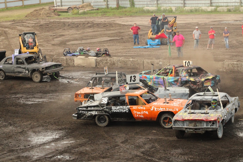 a group of cars that are in the dirt