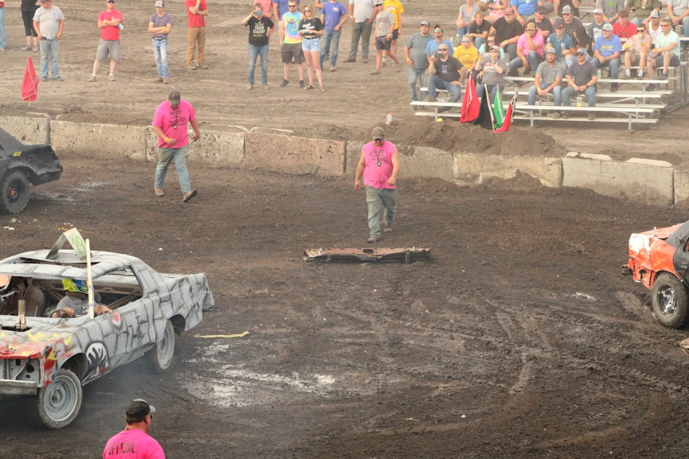 a group of people watching a monster truck race