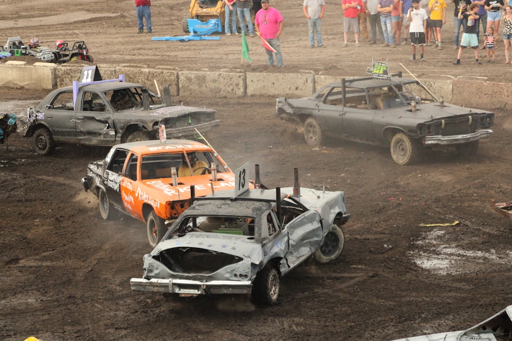 a couple of cars that are in the dirt