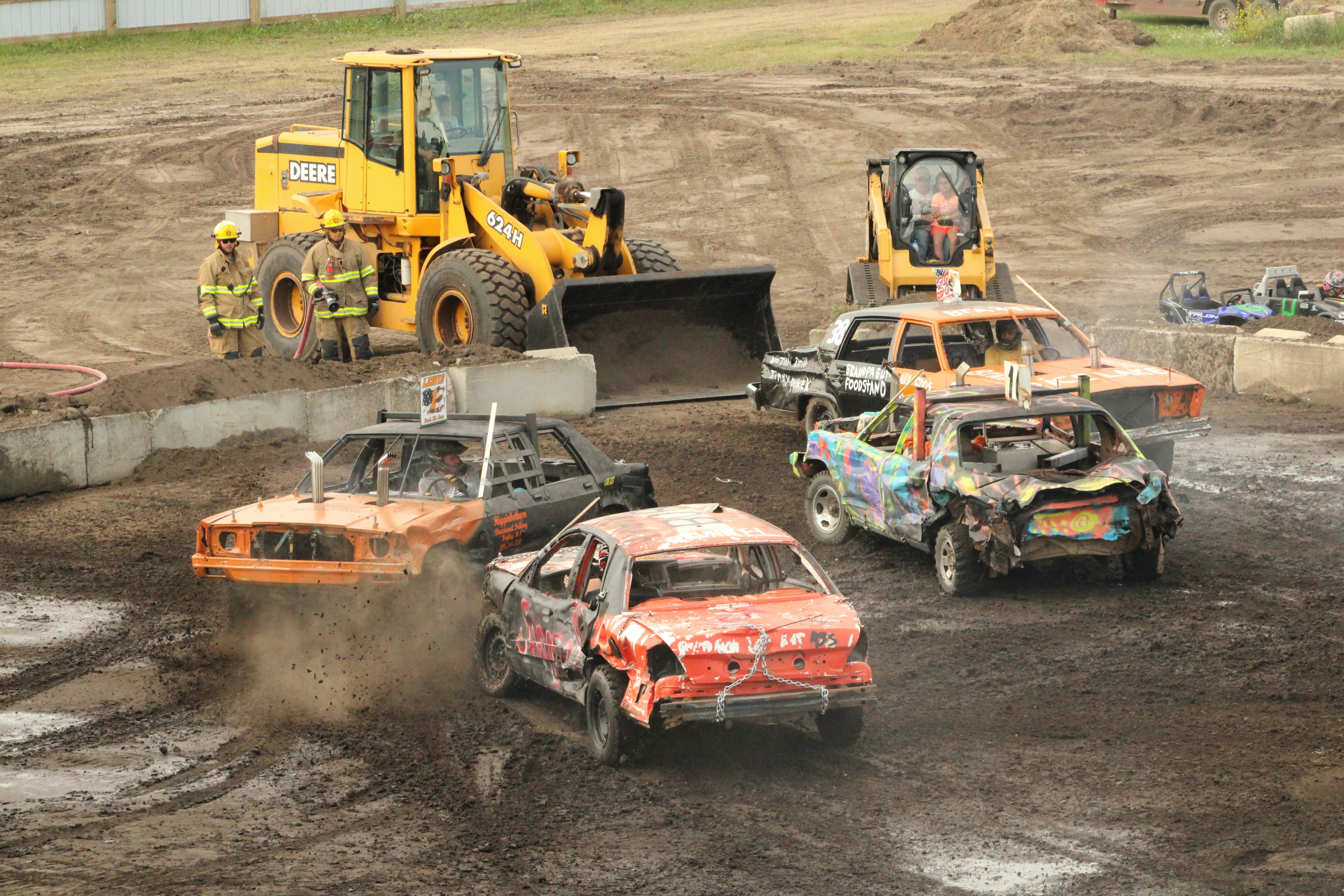 a couple of cars that are in the dirt