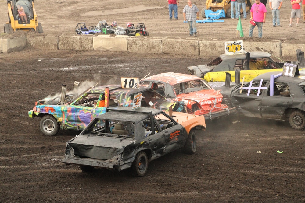 a couple of cars that are in the dirt