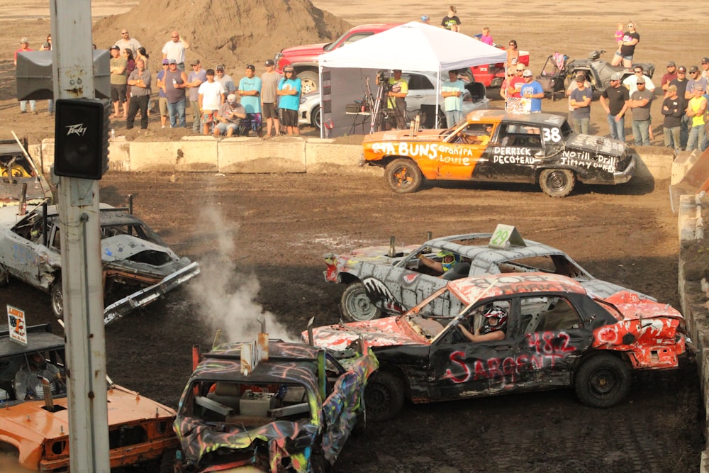 a group of cars that are sitting in the dirt