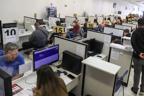a room full of people working on computers