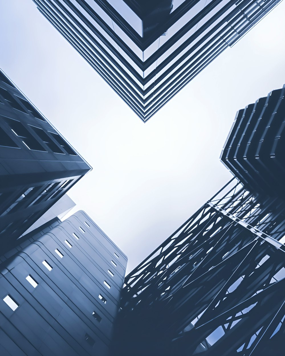 a group of tall buildings with a sky background