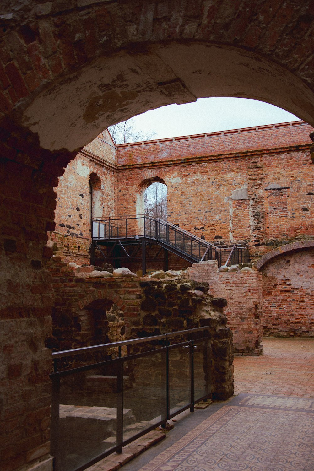 a brick building with a staircase going up the side of it