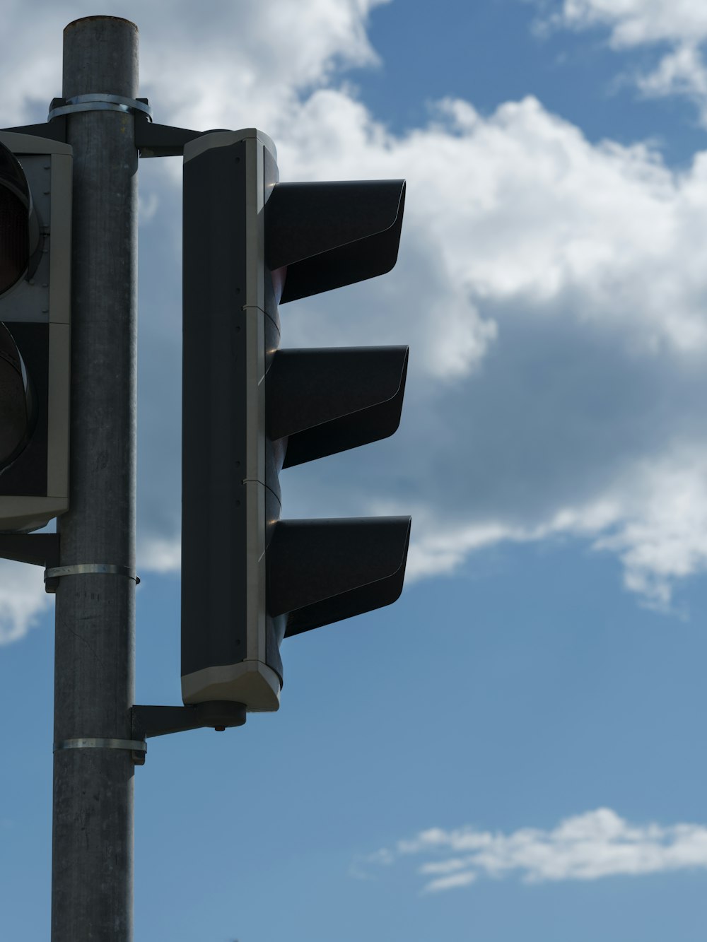 a traffic light with a sky in the background