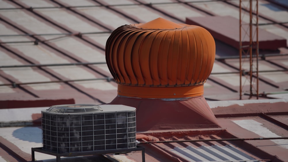 a roof ventilator on top of a building under construction