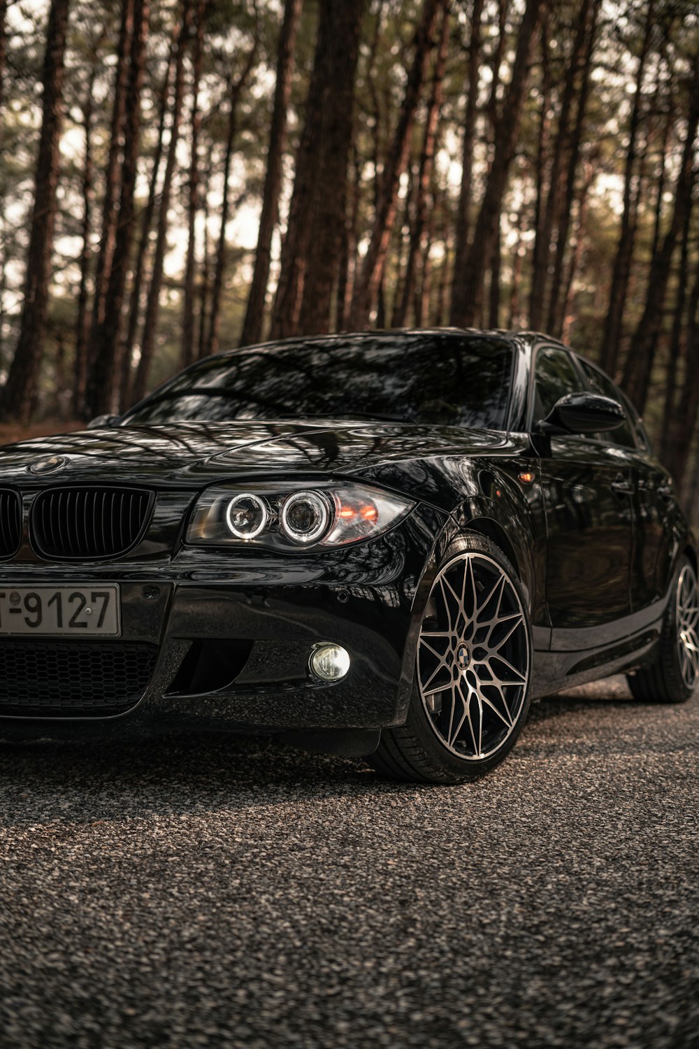 a black car parked on the side of the road