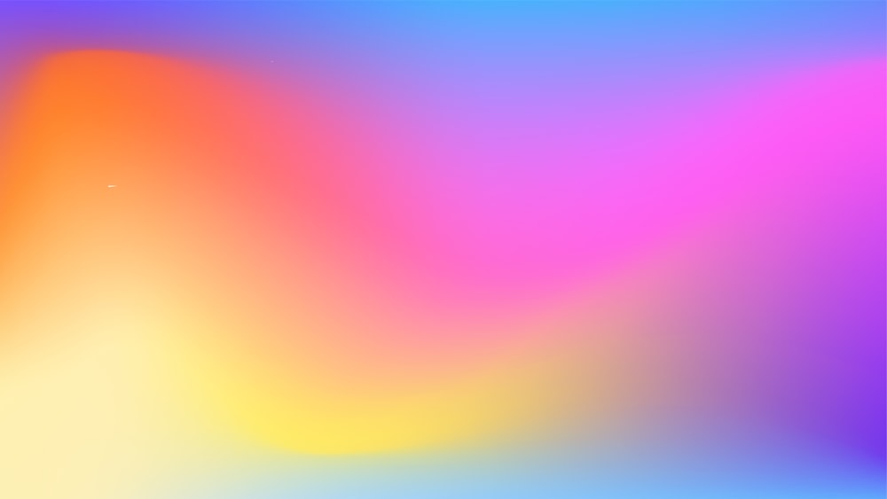 a blurry image of a rainbow colored background