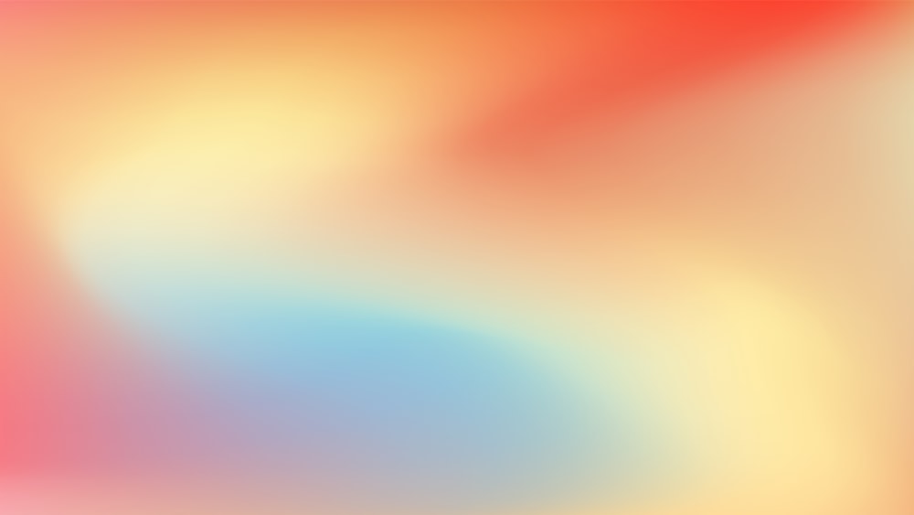 a blurry image of a red, yellow and blue background