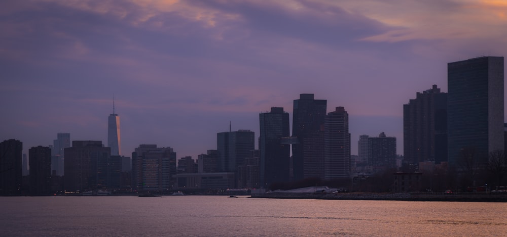 a large body of water with a city in the background