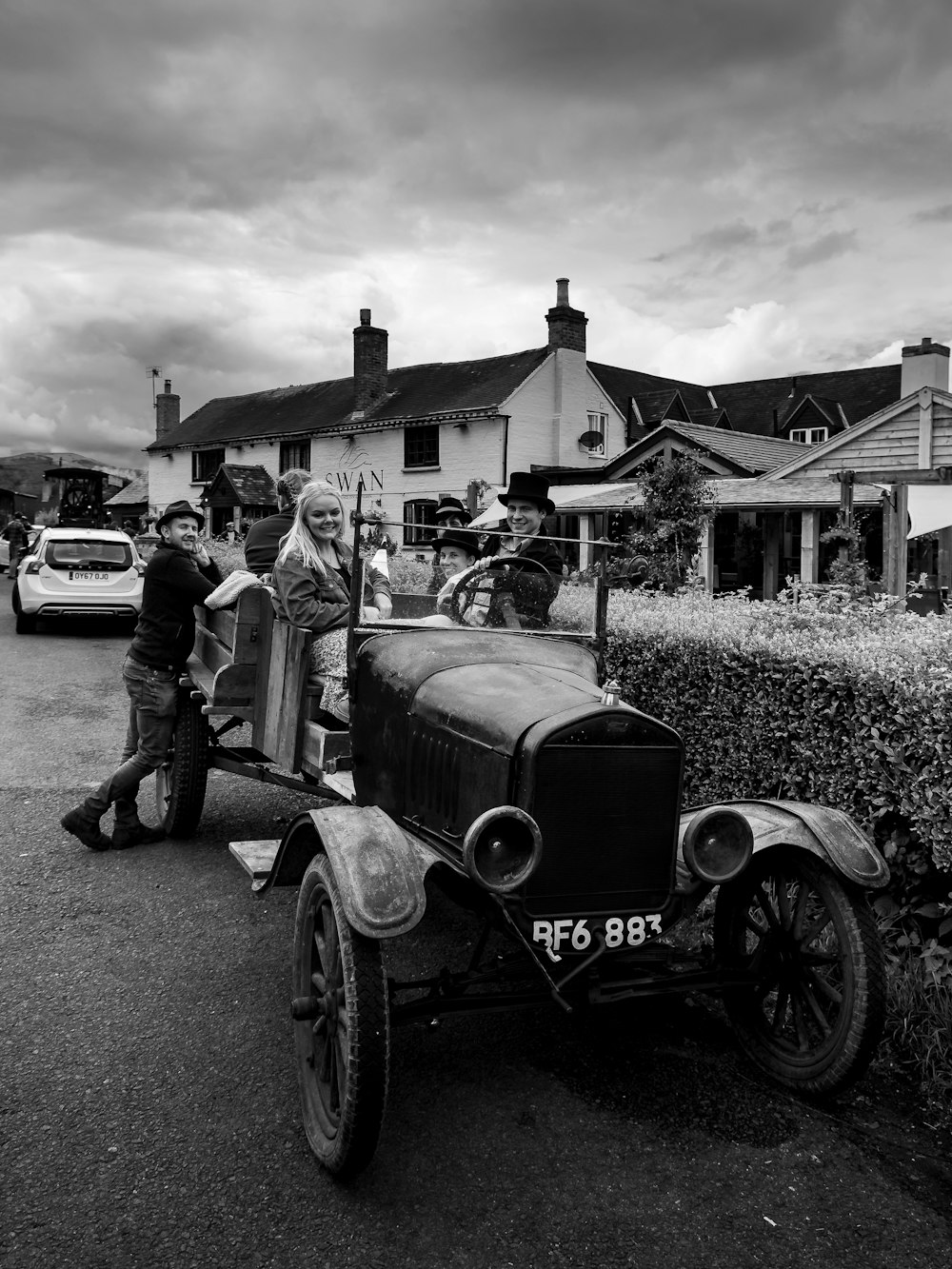 a black and white photo of an old car