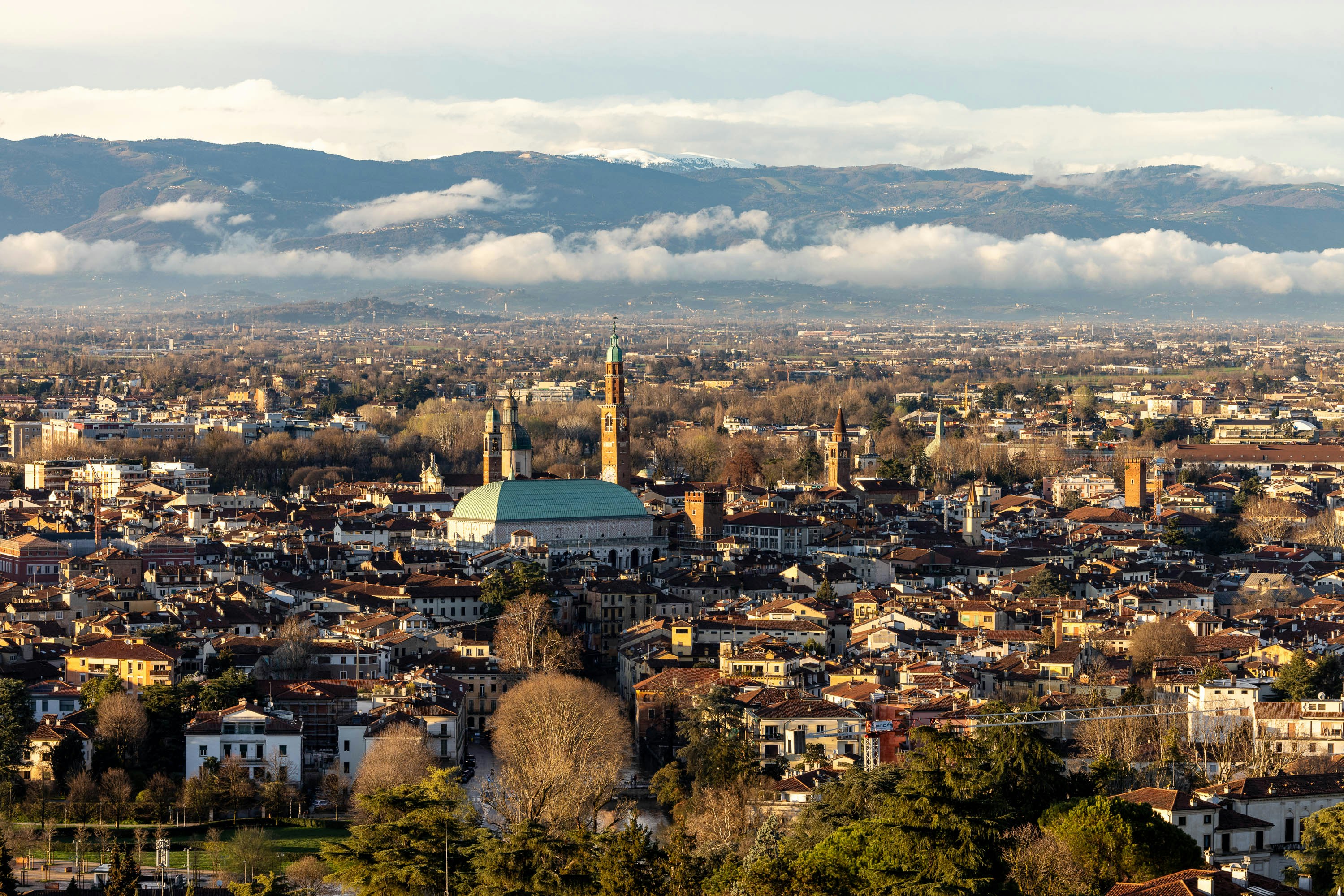 a view of a city with mountains in the background