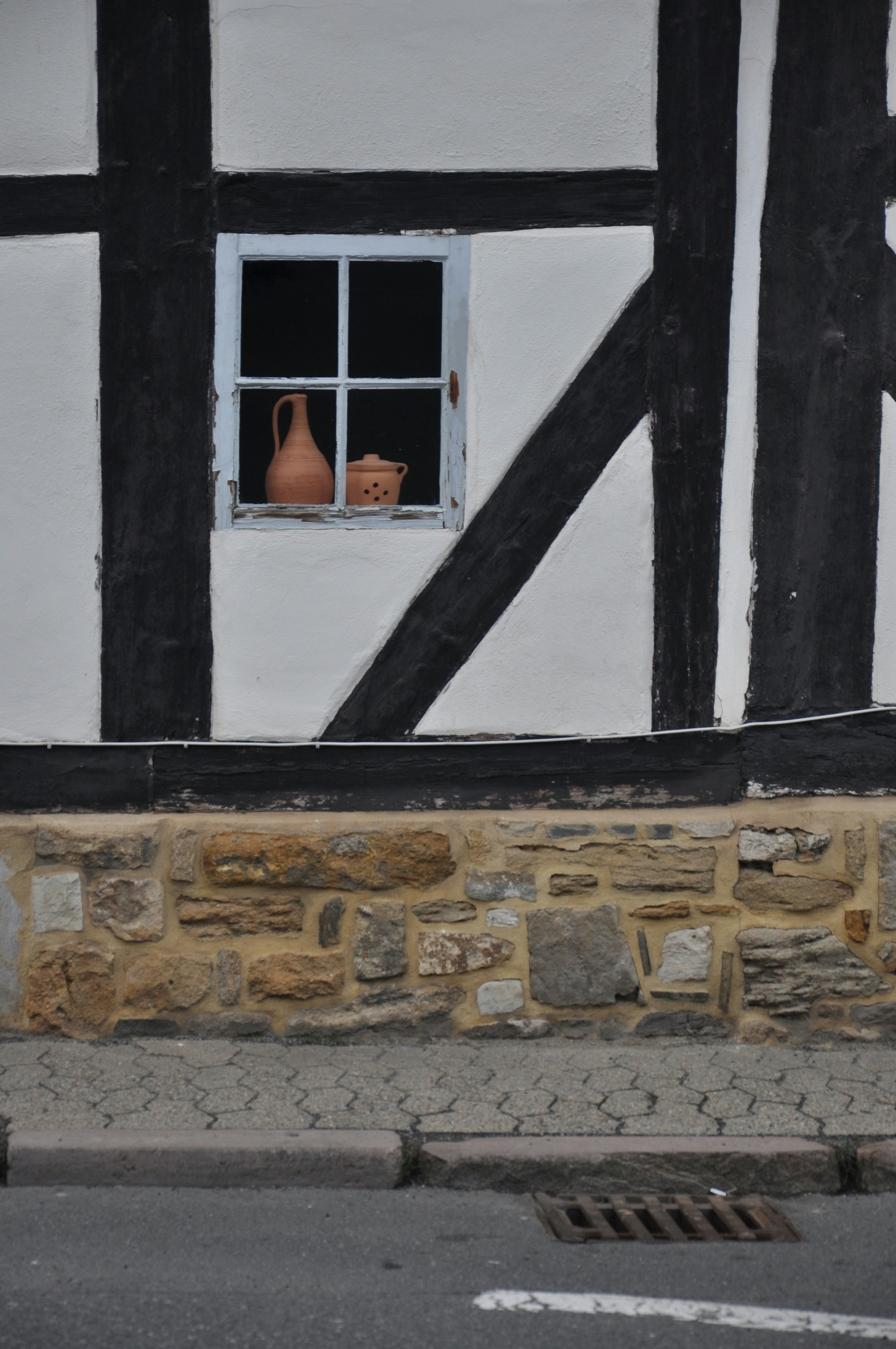 a vase is seen through a window of a house