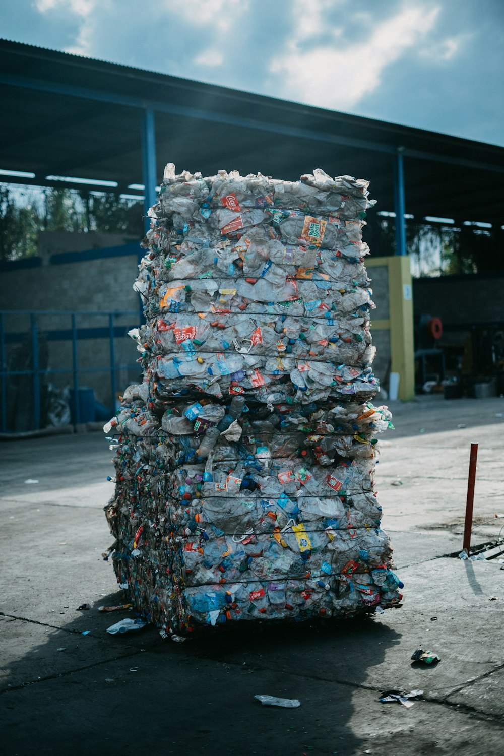 a large stack of garbage sitting in front of a building