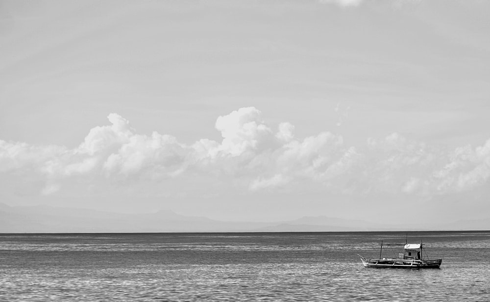 a boat floating on top of a large body of water