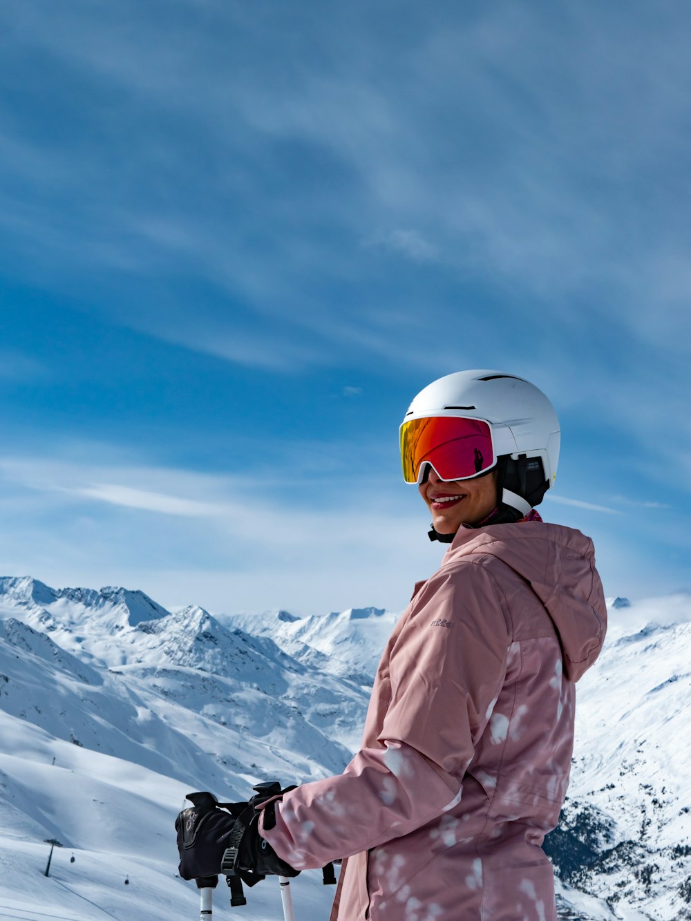 a person standing on a snow covered ski slope