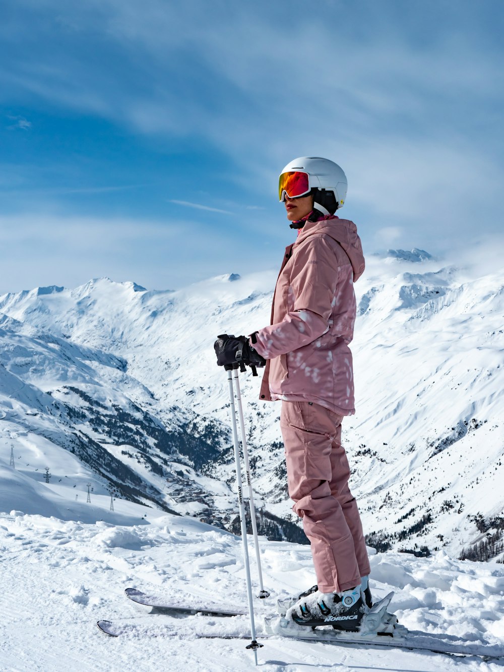 a person standing on skis in the snow