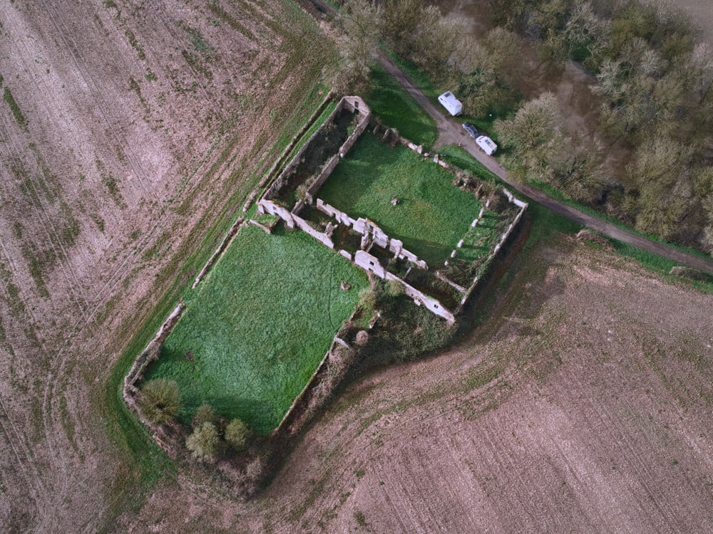 an aerial view of an old farm house