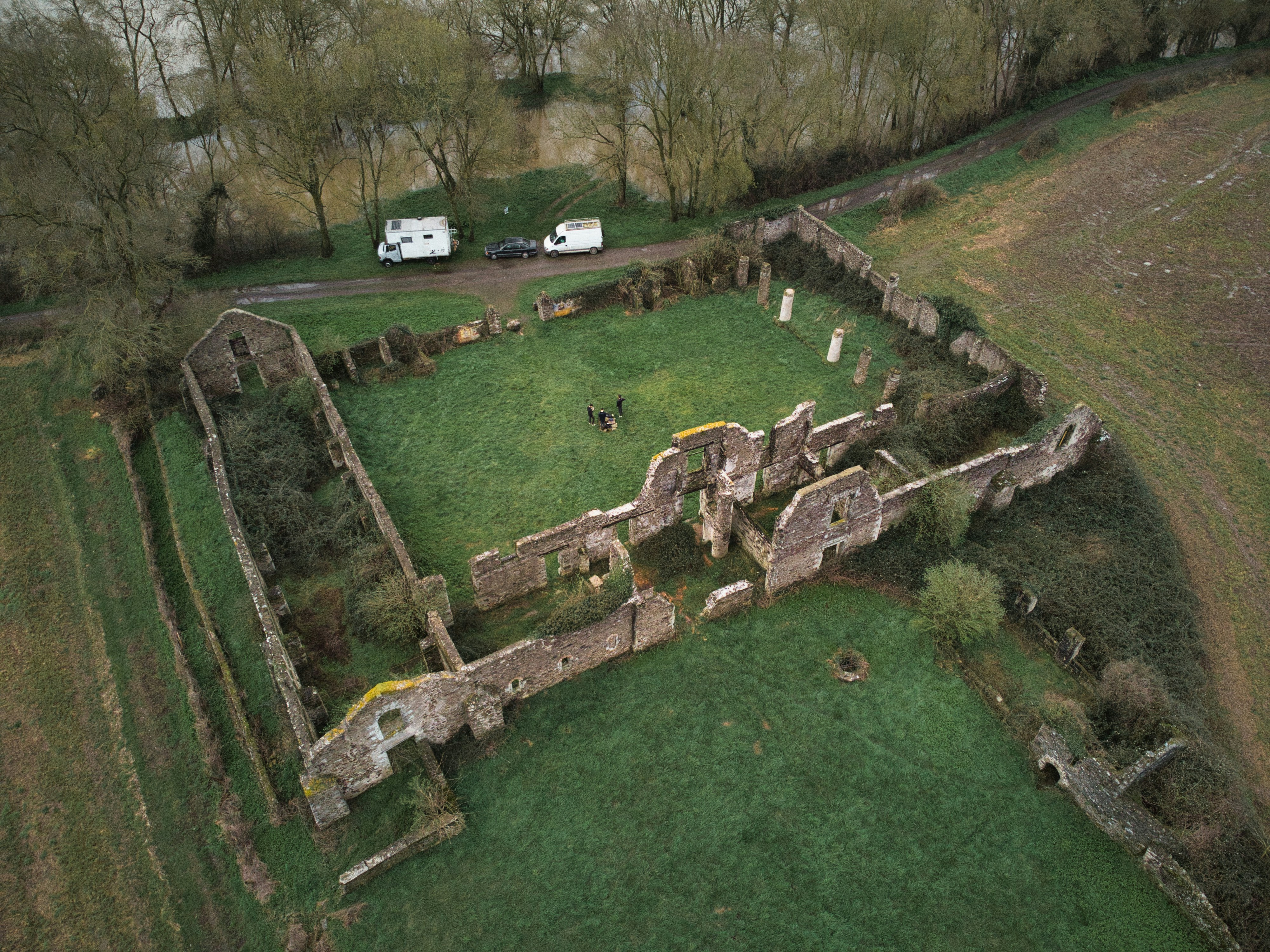 Hadrian’s Wall: Carlisle to Hexham – an aerial view of a castle with a green field