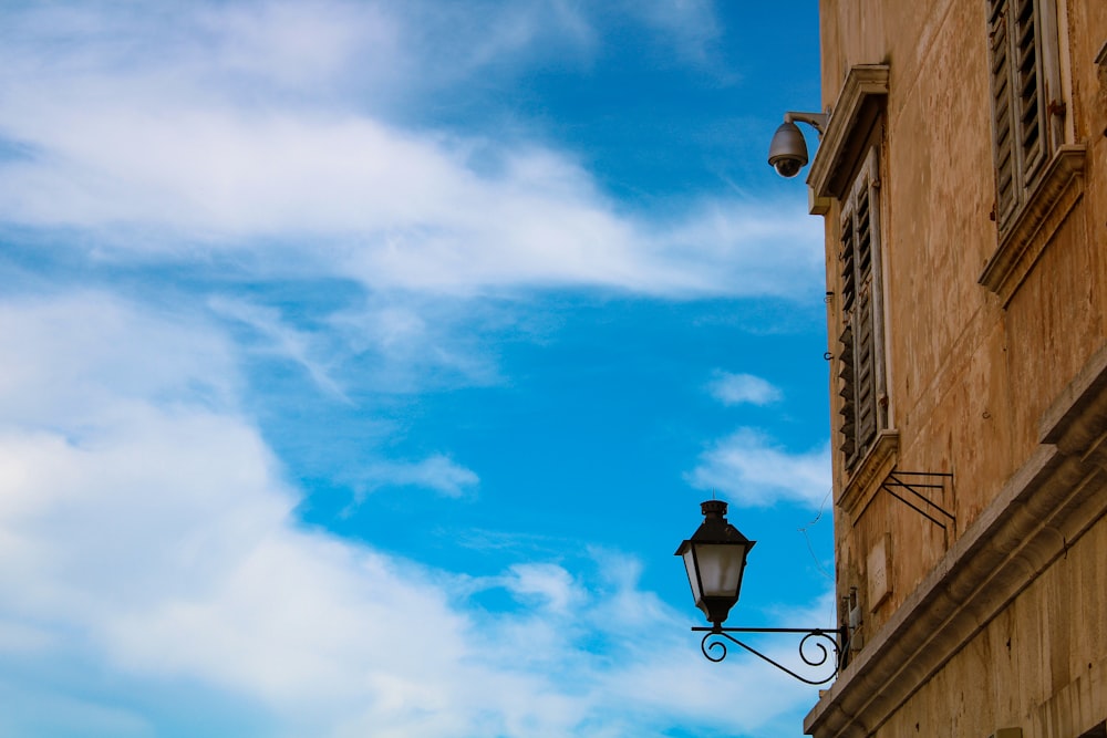 a street light hanging off the side of a building