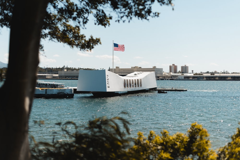 a large white building sitting on top of a body of water