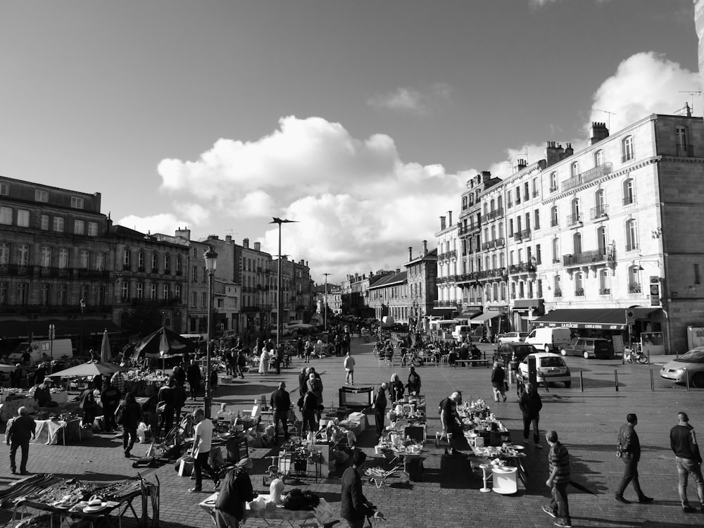 a black and white photo of a busy street
