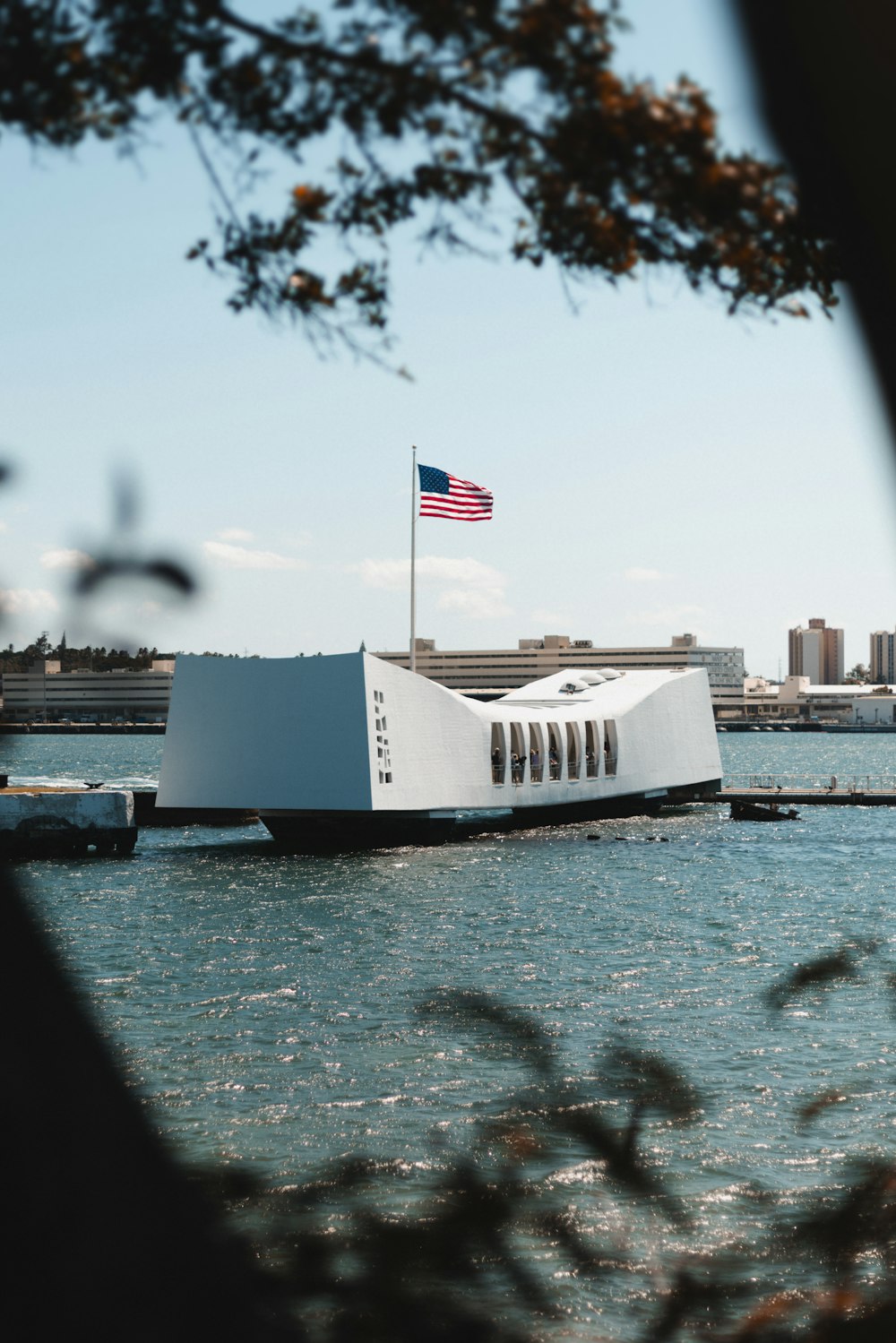 a large white building with a flag on top of it