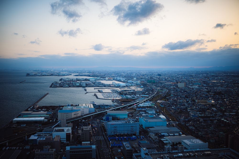 an aerial view of a city and a body of water