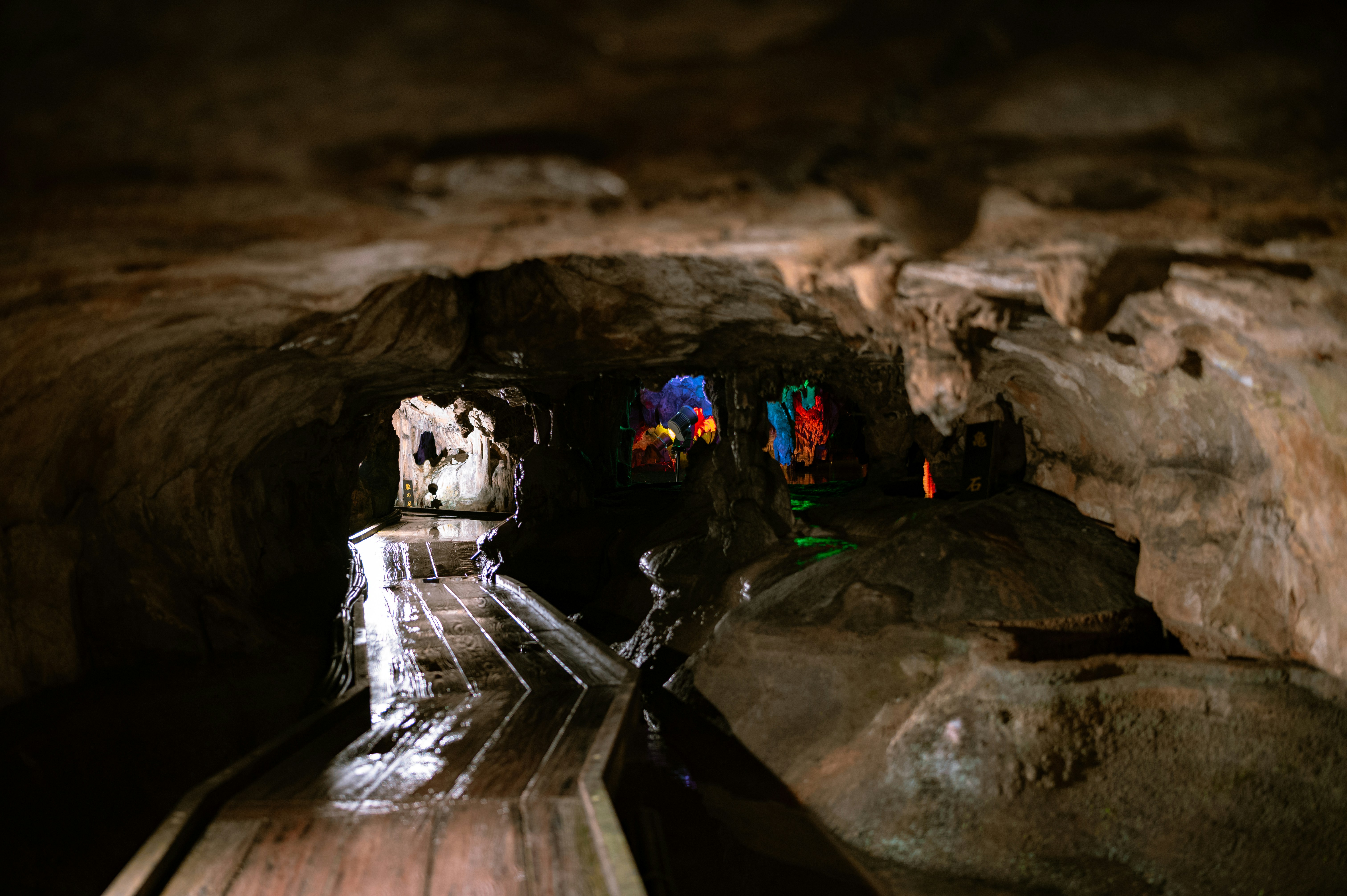 a long wooden walkway in a cave