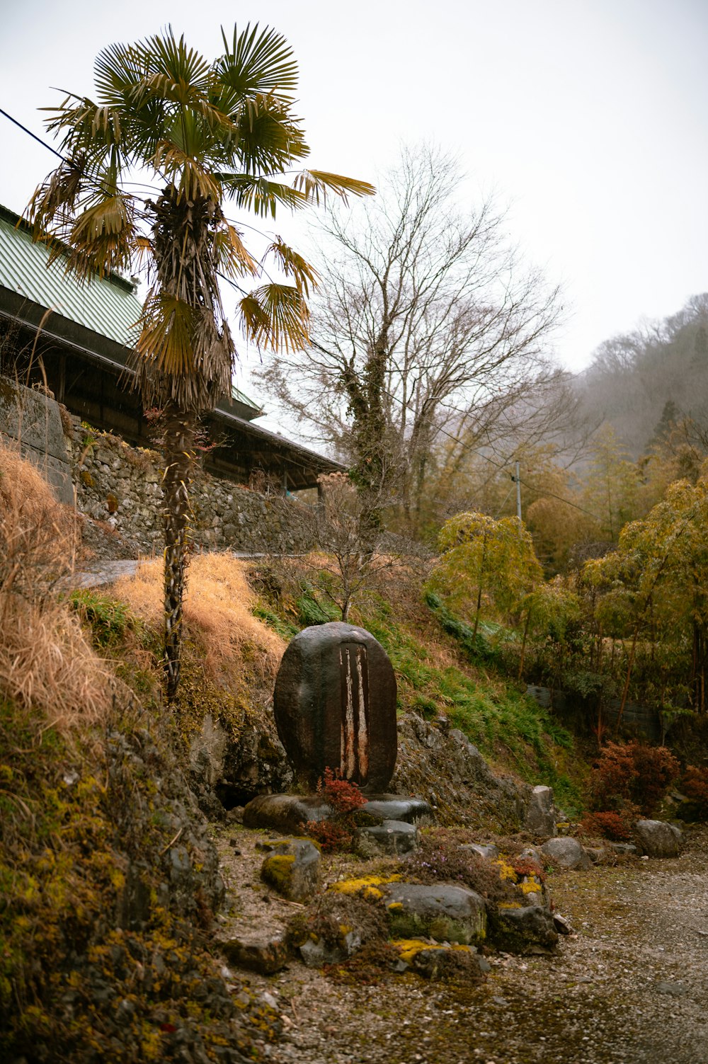 a large pot sitting on top of a lush green hillside