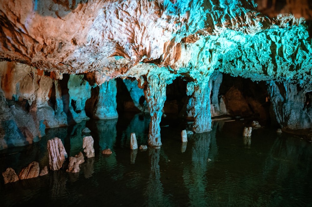 a group of people standing inside of a cave