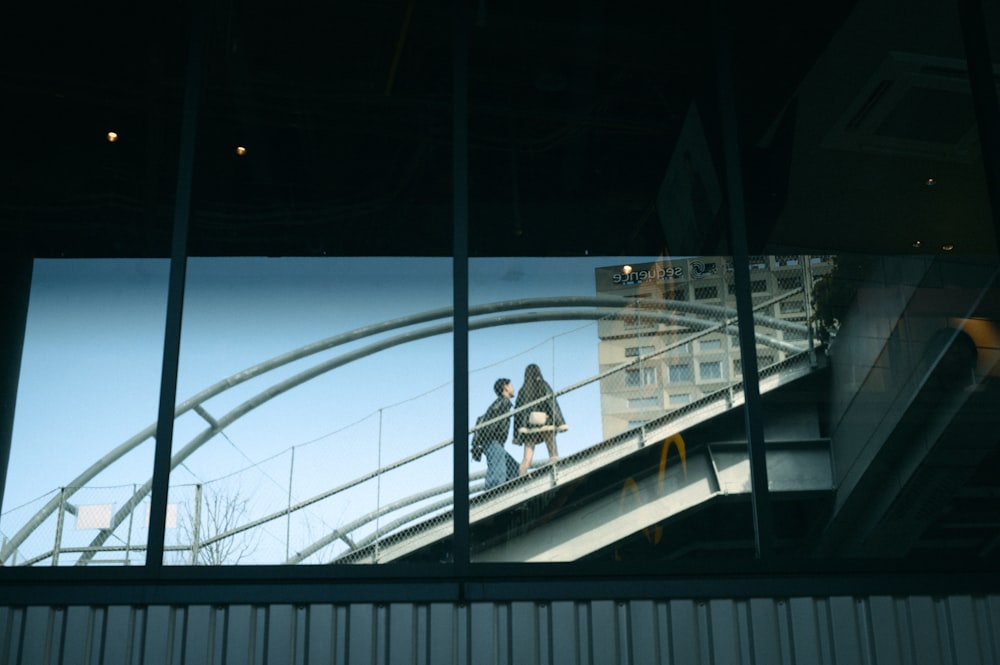 a couple of people that are walking up a set of stairs