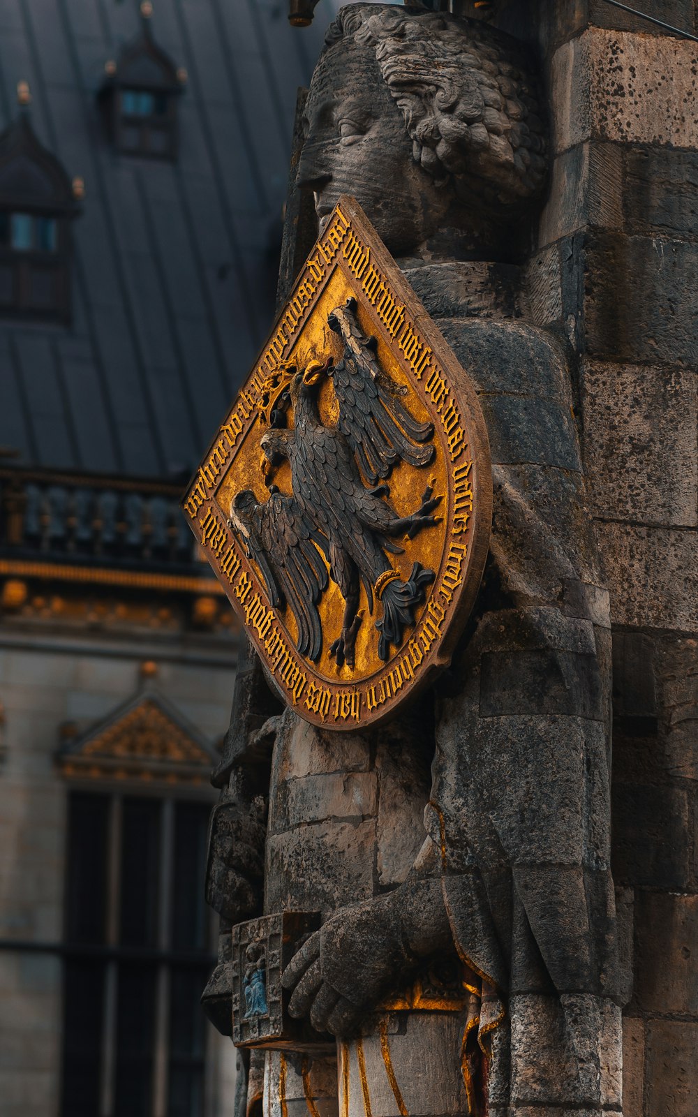 a close up of a statue of a lion on a building